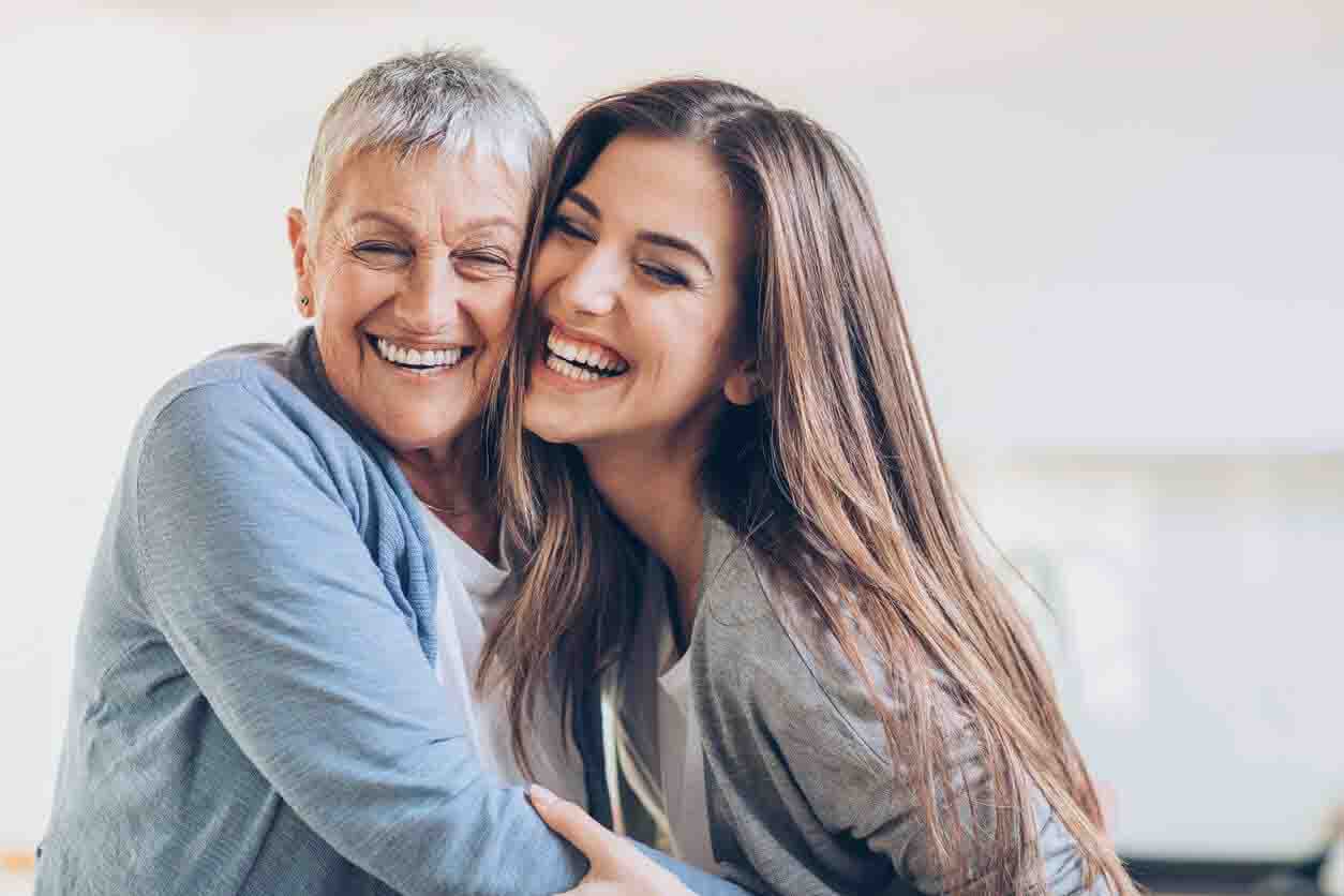 Mother and daughter hugging